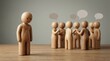 © alex - A lonely, sad wooden figure stands apart, observing a cheerful group in conversation, representing social exclusion, isolation, and the feeling of being left out