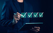 © WICHAI - Checklist verification concept with hand marking checkboxes on virtual interface, quality control, task completion, workflow management, productivity, business process, digital technology