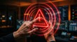 © Anat art - Hands interact with a holographic warning alert in a control room filled with screens and data displays at night.