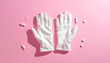 © aisyah - Pair of White Disposable Gloves on a Pink Background with Small Pills.