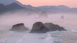 © JONATHAN - Misty coastal landscape with sea stacks at sunrise