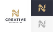 ©  Canella_std - Elegant 'N' letter logo design in gold and navy blue, perfect for branding and creative businesses