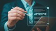 © Sabir - business professional approving digital document with futuristic holographic interface on tablet