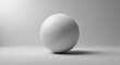 © Desingora - Smooth white sphere isolated on white background with subtle shadow
