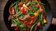 © MOMENUL071 - Delicious stir fry with beef strips green beans and colorful bell peppers