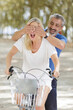 © auremar - plaful active seniors with a bicycle