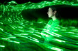 © Westend61 - Specialist surrounded by glowing green data waves in cyberspace