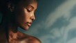 © progressman - Close-up portrait of a calm woman against a blurred blue backdrop