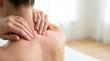 © Olesya - Woman massaging stiff neck after waking up in the morning. Person feeling muscle pain and tension due to poor posture or fatigue. Health care and recovery from sleeping discomfort.