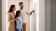 © Lumi Stock Studio - Family discussing renovation plans at home, parents and child looking at wall layout for interior design and home improvement planning