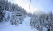 © Moritz Wolf/imageBROKER - Kälbersalven lift, chair lift in the SkiWelt ski area Wilder Kaiser Brixental, Brixen im Thale, Tyrol, Austria