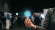 © Naret - Federated learning network concept with glowing light bulb in hand at trade show