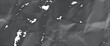 © Monirul - A grayscale image of crumpled paper with torn pieces on a surface