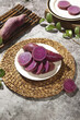 © CungVan - Fresh Purple Vietnamese Sweet Potatoes Sliced on Rustic Wicker Placemats Still Life Photography