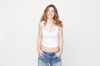 © MACO - Studio portrait of young woman in studio image.