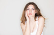 © MACO - Studio portrait of young beautiful woman.