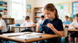 © Xenia - Focused elementary school girl in uniform cleaning her glasses with a cloth at her desk. Child preparing to study in a bright classroom