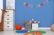 © New Africa - Child's room with colorful flags, toys and chest of drawers. Interior design