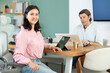 © JackF - Portrait of two business colleagues chatting about work in office