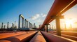 © Syamira - Industrial pipeline infrastructure at an oil refinery during a beautiful sunset.