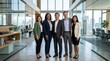 © Viacheslav - Confident diverse business team of colleagues posing together in a modern office, leadership, teamwork, workplace diversity, success and executive unity in a polished professional environment with