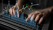© InfiniteFlow - Close-up view of hands typing on a laptop with overlaid financial graphs and market trends, illustrating stock analysis and investment strategies in a digital workspace. Scalp