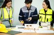 © Nuttapong punna - Three Asian architects discussing building model and blueprint. Architecture design, construction planning, teamwork and project management