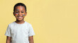 © AImageZ - African boy with face paint at birthday isolated on neutral background