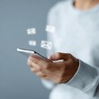 © Chandlerlikes - Person checking smartphone with floating email notification icons, digital communication, mobile inbox, clean background, copy space