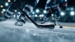 © vetrana - Hockey players skate and battle for puck during game on ice rink in arena at night with bright lights