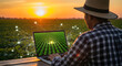 © fitria - Farmer using a laptop in a field at sunset, with digital connections overlayed on the image.