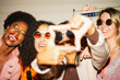 © DisobeyArt - Crazy women friends having fun at night time listening music outdoor - Party, nightlife and people lifestyle concept - UGC flash content - Main focus on center right girl