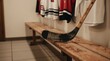 © Maryna - Old wooden hockey stick rests on bench in locker room with jerseys hanging above. Preparation for winter sport game in arena. Retro athletic equipment detail.