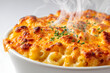© Thisisbest - Classic American Mac and Cheese Dish with Steaming Cheesy Topping Freshly Baked and Isolated on White Background