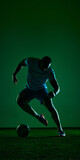 Soccer player dribbling ball in dark green studio sport scene. Concept of football agility, speed training, athletic gear campaign, coaching content and match preparation.