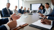 © ViskBx - Business people sitting around a conference table during a meeting in a modern office