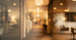 © Vhagar - A softly blurred interior view of an office corridor, featuring modern decor, soft lighting and plants, creating a calm and inviting atmosphere.