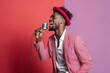 © Markus Schröder - Portrait of a glad afro-american man in his 30s dancing and singing song in microphone while standing against pastel or soft colors background