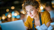 © Aliaksandra - Small business owner working on laptop in cozy cafe with focused modern entrepreneur mood