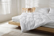 © New Africa - Orthopedic mattress, pillows and duvet on bed at home