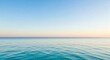© G_Kawi - Vue paisible sur l'océan avec un horizon bleu clair et une eau calme en arrière-plan