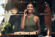 © peopleimages.com - Portrait, phone call and woman with smile, pizza and delivery order with customer service. Happy, client or person with tech for chatting, review business or digital app for communication or takeaway