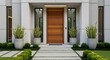 © Shomsu Miah - Modern home entrance with wooden door and landscaped pathway