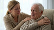 © moonguyen - Woman Comforting Elderly Man, Sadness and Support