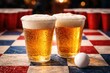 © AkuAku - Frothy cold beer pong scene showing dual glass cups and a textured checkered background