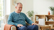 © OlgaNeuroArt - Senior man using portable oxygen concentrator at home. Elderly male patient with nasal cannula for respiratory therapy. Home healthcare and wellness concept