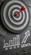 © olga_demina - A creative and symbolic representation of business growth and success, featuring a target with a red arrow and a bar graph on a blackboard