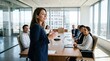 © ryker - Confident businesswoman leading diverse team meeting in modern glass office with city views, presenting strategy and engaging colleagues with professional energy and collaboration