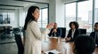 © ryker - Poised East Asian businesswoman leading boardroom meeting, confident presentation in modern office with diverse colleagues attentive and professional
