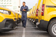 © Ljupco Smokovski - Mechanic inspecting yellow vans